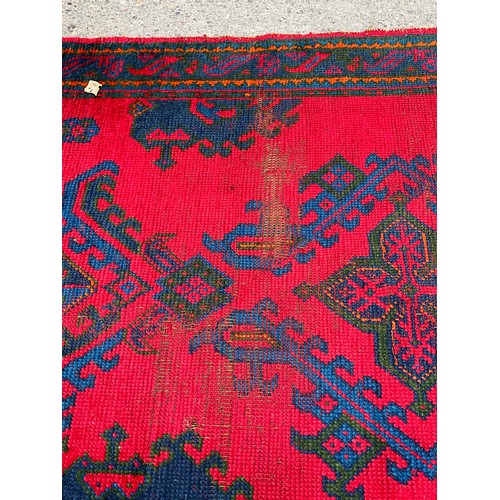 159 - VINTAGE RED MULTI PATTERNED WOVEN CARPET 78” x 53”