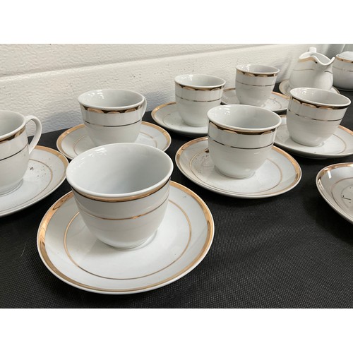 32 - LARGE FORTY NINE PIECE MODERN WHITE CHINA TEA AND DINNER SERVICE WITH GOLD RIM DECORATION