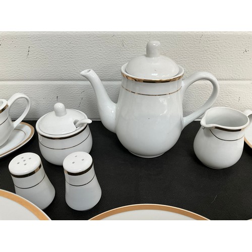 32 - LARGE FORTY NINE PIECE MODERN WHITE CHINA TEA AND DINNER SERVICE WITH GOLD RIM DECORATION