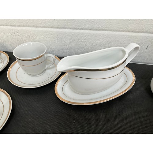 32 - LARGE FORTY NINE PIECE MODERN WHITE CHINA TEA AND DINNER SERVICE WITH GOLD RIM DECORATION