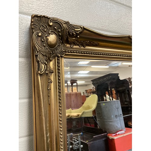 39 - REPRODUCTION GILT DECORATIVE FRAMED BEVELLED EDGE WALL MIRROR 36” x 26”