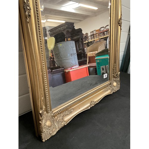 39 - REPRODUCTION GILT DECORATIVE FRAMED BEVELLED EDGE WALL MIRROR 36” x 26”