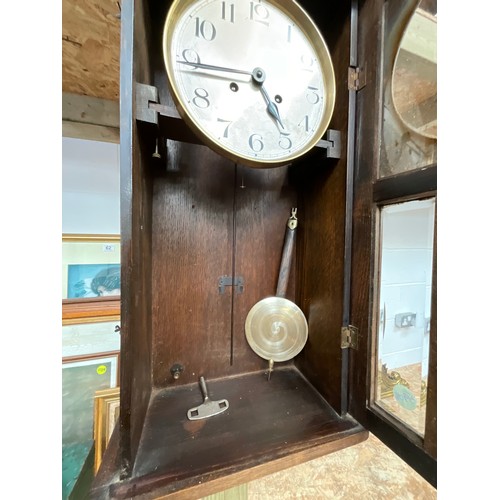 66 - VINTAGE OAK CASED WALL CLOCK WITH KEY AND PENDULUM H33” W13” D7”