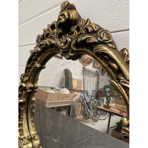 89 - ORNATE GILT PLASTER FRAMED WALL MIRROR 
23” x 20”