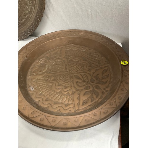 111 - INDIAN BRASS PLAQUE AND THREE BRASS TRAYS