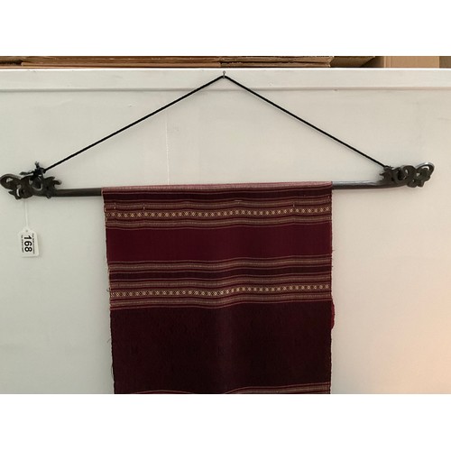 168 - CARVED MAHOGANY AND LINEN WALL HANGING 64” x 28”