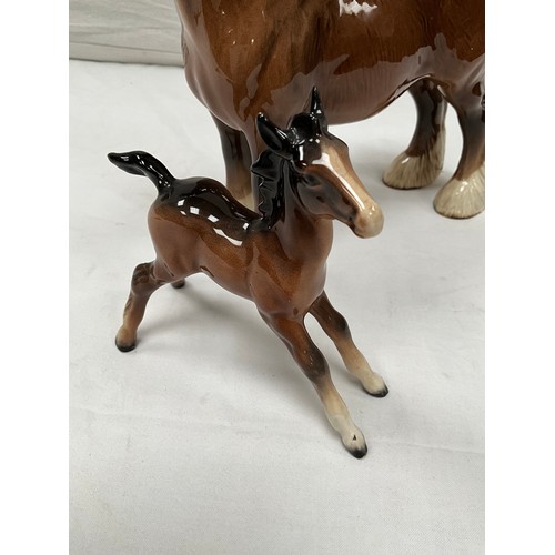 185 - BESWICK SHIRE HORSE AND TWO BESWICK FOALS (ONE FOAL HAS LOST HIS EAR)