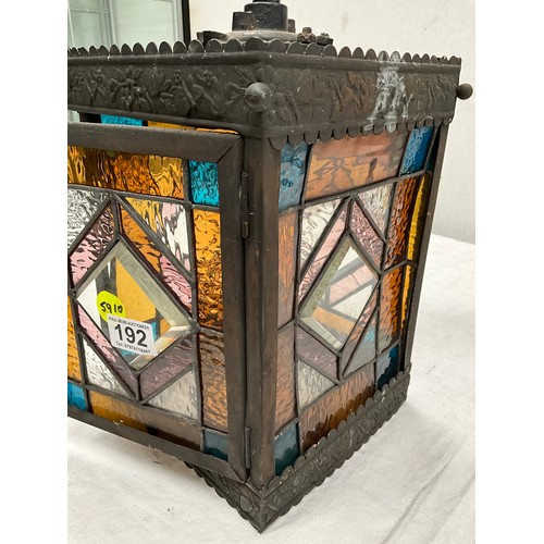 192 - BRASS WALL LANTERN WITH COLOURED GLASS PANELS H11” AND 8” SQUARE A/F