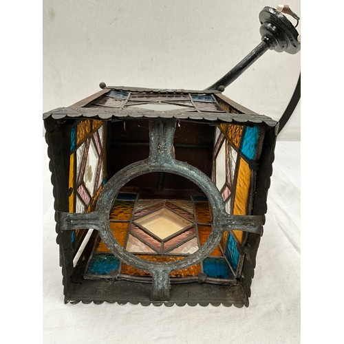 192 - BRASS WALL LANTERN WITH COLOURED GLASS PANELS H11” AND 8” SQUARE A/F