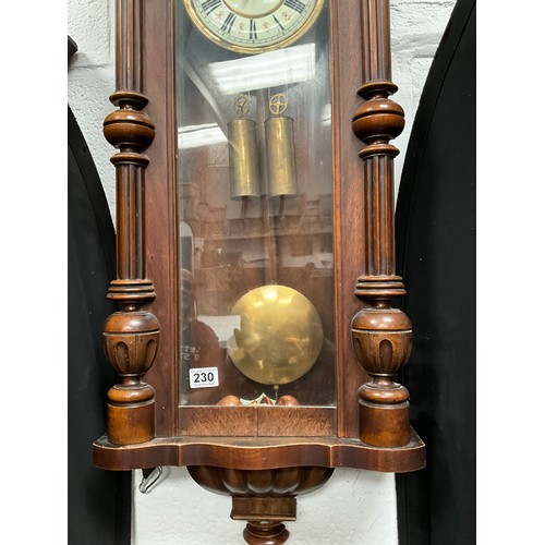 230 - VICTORIAN MAHOGANY TWIN WEIGHT VIENNA WALL CLOCK WITH EAGLE DECORATION TO TOP A/F 
H54” W19” D7”