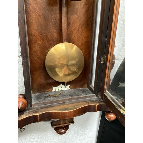 230 - VICTORIAN MAHOGANY TWIN WEIGHT VIENNA WALL CLOCK WITH EAGLE DECORATION TO TOP A/F 
H54” W19” D7”