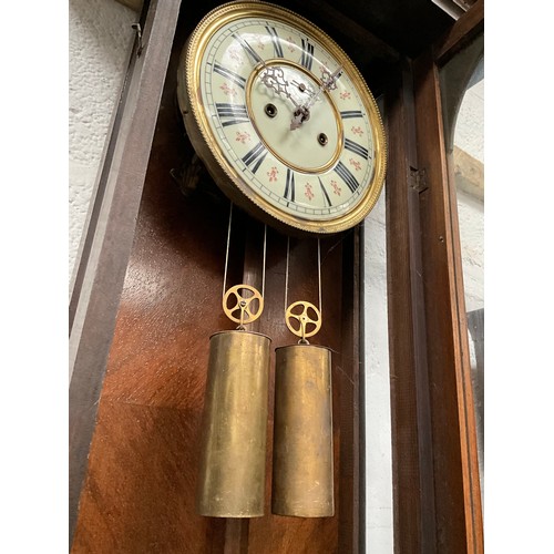 230 - VICTORIAN MAHOGANY TWIN WEIGHT VIENNA WALL CLOCK WITH EAGLE DECORATION TO TOP A/F 
H54” W19” D7”