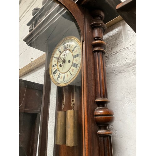 230 - VICTORIAN MAHOGANY TWIN WEIGHT VIENNA WALL CLOCK WITH EAGLE DECORATION TO TOP A/F 
H54” W19” D7”