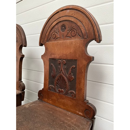 288 - PAIR OF EDWARDIAN MAHOGANY CARVED SHIELD BACK HALL CHAIRS.