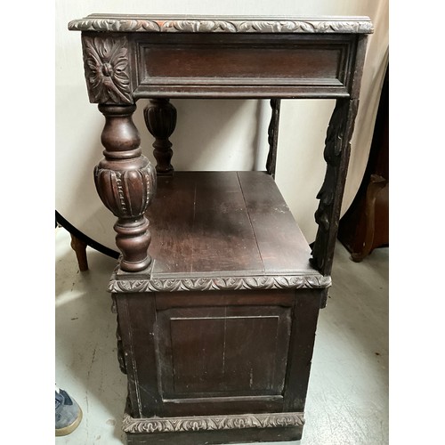 308 - VICTORIAN HEAVILY CARVED OAK SERVING CABINET WITH CARVED PANEL DOOR TO BASE H36” W27” D17”