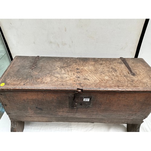 377 - EARLY OAK SWORD OR COFFER WITH CANDLE BOX TO INTERIOR WITH HANDMADE IRON HINGES AND CLASP 
H26”W44” ... 