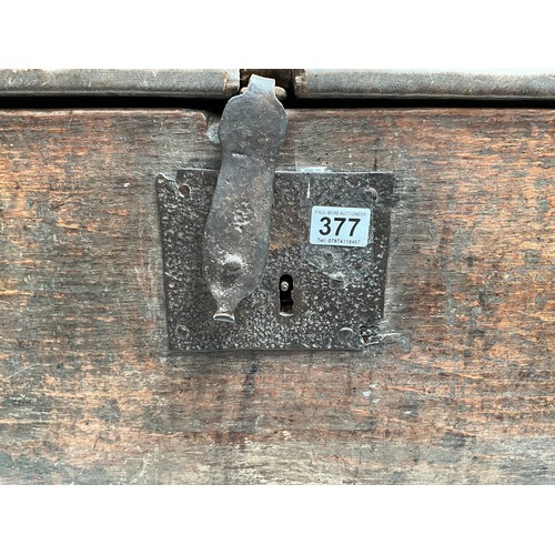 377 - EARLY OAK SWORD OR COFFER WITH CANDLE BOX TO INTERIOR WITH HANDMADE IRON HINGES AND CLASP 
H26”W44” ... 