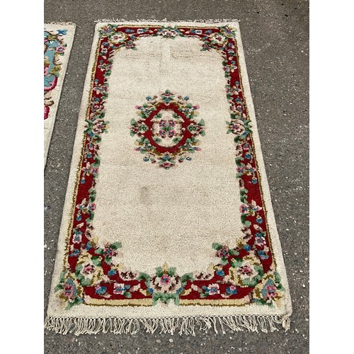 384 - TWO VINTAGE PATTERNED RUGS 78” x 39” AND 78” x 38”