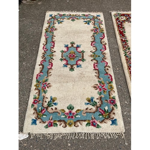 384 - TWO VINTAGE PATTERNED RUGS 78” x 39” AND 78” x 38”