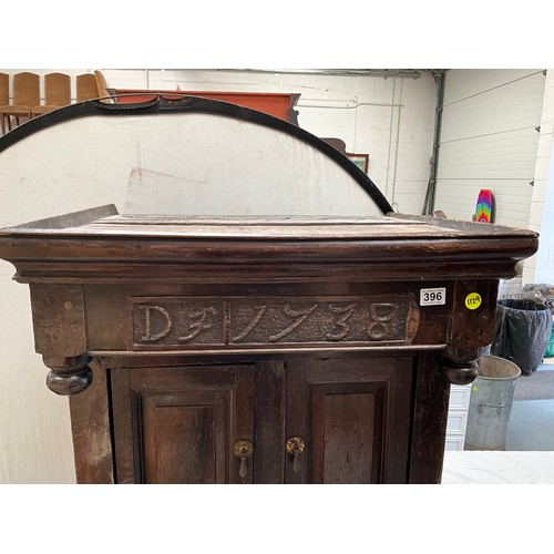 396 - EARLY OAK COURT CUPBOARD DATED 1738 WITH 2 DOORS OVER SINGLE DRAWER AND PANELED DOOR BELOW (BROKEN N... 