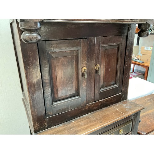 396 - EARLY OAK COURT CUPBOARD DATED 1738 WITH 2 DOORS OVER SINGLE DRAWER AND PANELED DOOR BELOW (BROKEN N... 