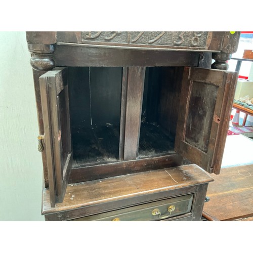 396 - EARLY OAK COURT CUPBOARD DATED 1738 WITH 2 DOORS OVER SINGLE DRAWER AND PANELED DOOR BELOW (BROKEN N... 