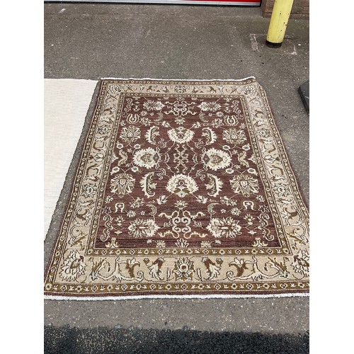 438 - 2 MODERN RUGS
Brown 74” x 57” and cream 76” x 47”