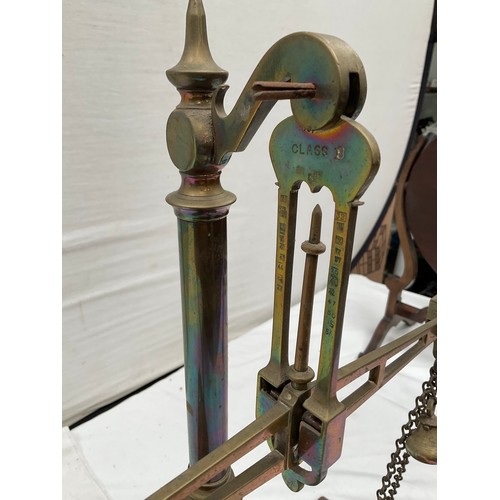 439 - VICTORIAN BRASS BALANCE SCALES COMPLETE WITH WEIGHTS AND TRAYS MOUNTED ON A MAHOGANY PLINTH 
H23” W2... 