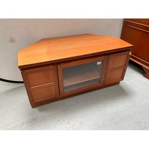 464 - BADGED NATHAN TEAK CORNER TV STAND WITH CENTRAL GLASS DOOR FLANKED BY 2 DOORS  H20” W41” D20”