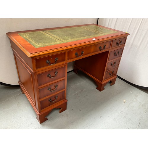 466 - REPRODUCTION YEW WOOD KNEEHOLE TWIN PEDESTAL DESK WITH 9 DRAWERS AND INSET LEATHER TOP 
H30” W48” D2... 