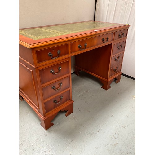 466 - REPRODUCTION YEW WOOD KNEEHOLE TWIN PEDESTAL DESK WITH 9 DRAWERS AND INSET LEATHER TOP 
H30” W48” D2... 