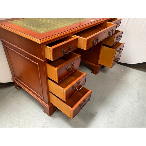 466 - REPRODUCTION YEW WOOD KNEEHOLE TWIN PEDESTAL DESK WITH 9 DRAWERS AND INSET LEATHER TOP 
H30” W48” D2... 