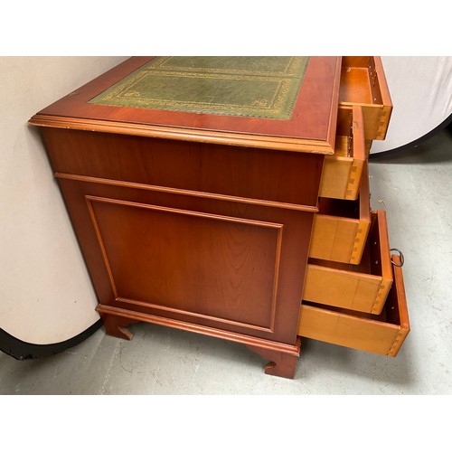 466 - REPRODUCTION YEW WOOD KNEEHOLE TWIN PEDESTAL DESK WITH 9 DRAWERS AND INSET LEATHER TOP 
H30” W48” D2... 