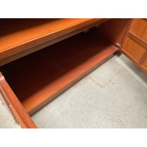 486 - BADGED NATHAN TEAK LOUNGE UNIT WITH OPEN SHELVES TO TOP OVER 2 DOORS H76” W40” D18” (glassware not i... 