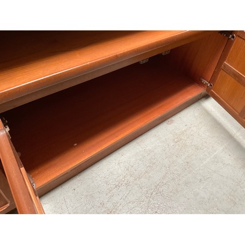 487 - BADGED NATHAN TEAK LOUNGE UNIT WITH OPEN SHELVES TO TOP OVER 2 DOORS TO BASE H72” W40” D18”