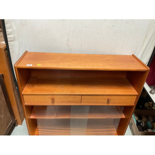 490 - BADGED NATHAN TEAK BOOKCASE WITH 2 DRAWERS OVER GLASS SLIDING DOORS H42” W40” D12”