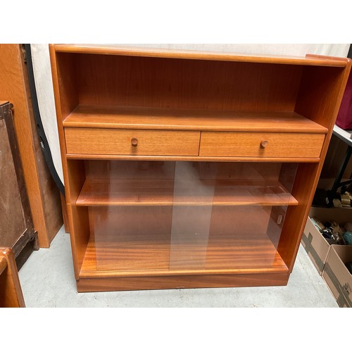 490 - BADGED NATHAN TEAK BOOKCASE WITH 2 DRAWERS OVER GLASS SLIDING DOORS H42” W40” D12”