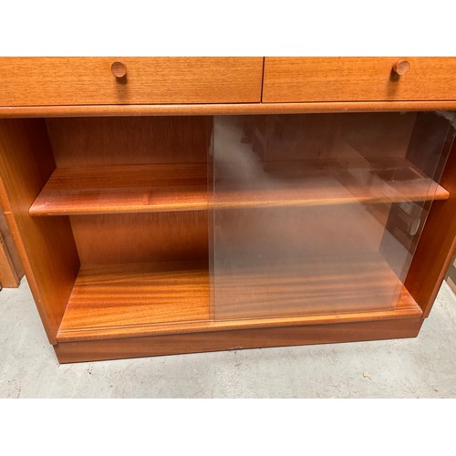 490 - BADGED NATHAN TEAK BOOKCASE WITH 2 DRAWERS OVER GLASS SLIDING DOORS H42” W40” D12”