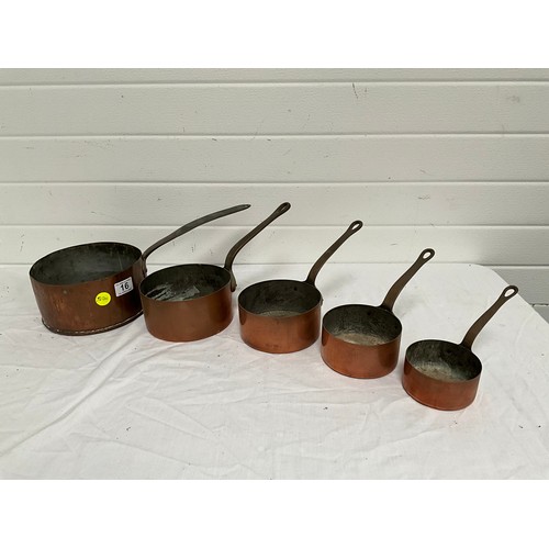 16 - A SET OF FIVE GRADUATED COPPER SAUCEPANS