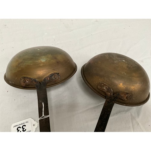 33 - TWO VINTAGE BRASS AND IRON SCOOPS