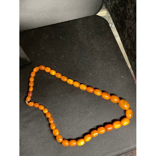 81 - TWO AMBER NECKLACES AND A PAIR OF EARINGS A/F TOTAL WEIGHT 45.2G