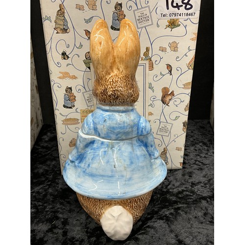 148 - QUANTITY OF BEATRIX POTTER TO INCLUDE MRS TIGGYWINKLE COOKIE JAR, PETER RABBIT JAR ETC WITH PRESENTA... 