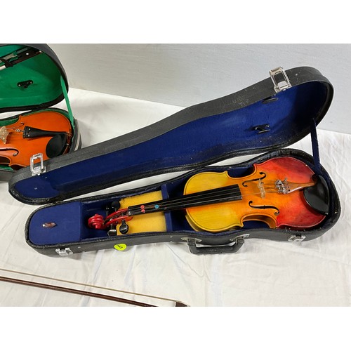 150 - TWO CASED VIOLINS AND SPARE BOW