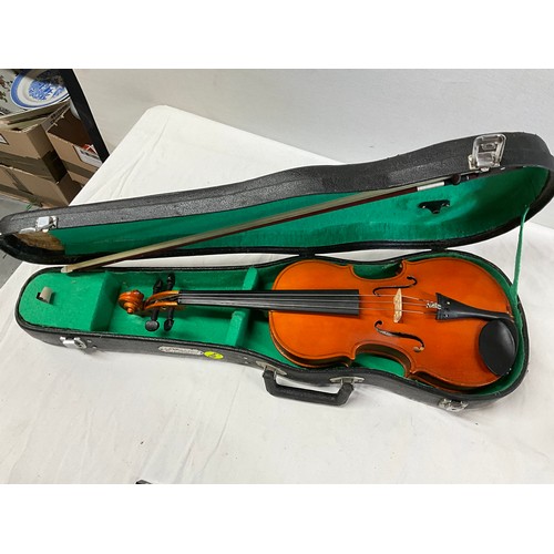 150 - TWO CASED VIOLINS AND SPARE BOW