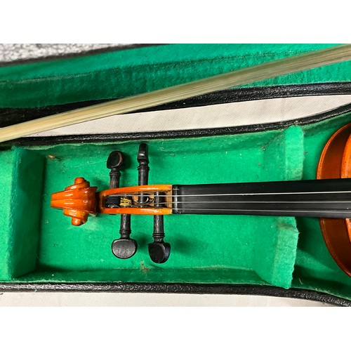 150 - TWO CASED VIOLINS AND SPARE BOW