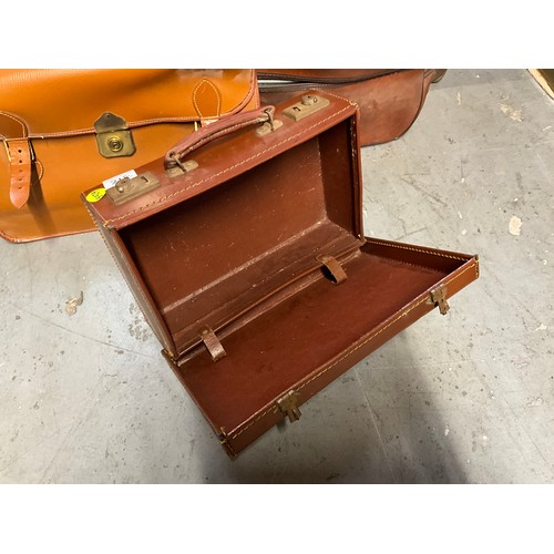 318 - QUANTITY OF VINTAGE SUITCASES,BRIEFCASE AND TWO BOWLING WOODS.