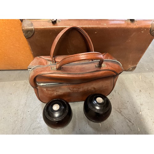 318 - QUANTITY OF VINTAGE SUITCASES,BRIEFCASE AND TWO BOWLING WOODS.