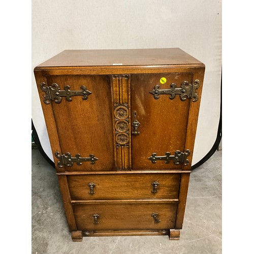 490 - VINTAGE OAK TWO DOOR OVER TWO DRAWERS TALLBOY WITH CARVED PANEL FRONT H42