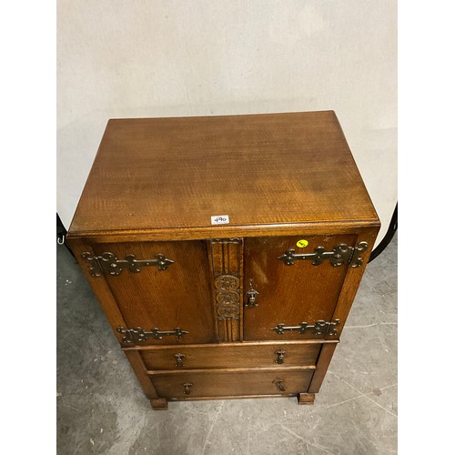 490 - VINTAGE OAK TWO DOOR OVER TWO DRAWERS TALLBOY WITH CARVED PANEL FRONT H42