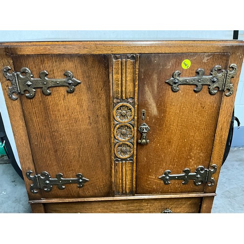 490 - VINTAGE OAK TWO DOOR OVER TWO DRAWERS TALLBOY WITH CARVED PANEL FRONT H42